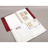 An album of St Vincent first day covers Kings and Queens of England, along with an album of stamps