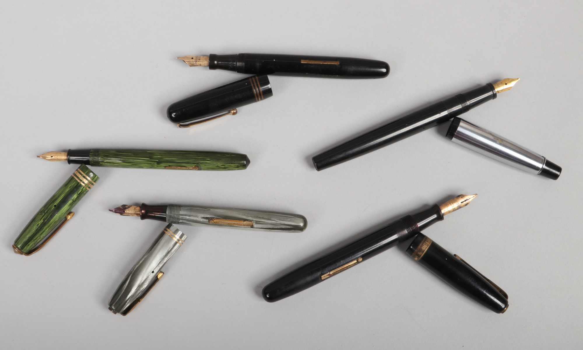 Four vintage fountain pens to include Varsity Pressmatic, Conway Stewart 36 Swan self filler and two