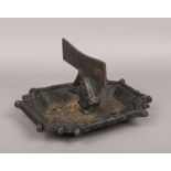 A Victorian cast iron boot scrape.