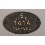A vintage oval cast iron builders wall plaque reads; S 1951 1414 Ashford.