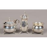 A silver three piece set to include preserve pot with glass Bristol blue liner, shaker, sugar pot,