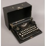 A vintage cased standard portable typewriter made in America by Underwood.