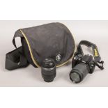 A Nikon D60 camera with Nikon DX zoom lens in carry case.