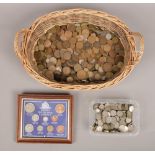 A basket of British pre-decimal coins to include a framed pre-decimal currency set.