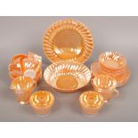 An anchor hocking iridescent orange glass six part tea set.