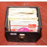 A carry case of 45rpm single records to include Rolling Stones, The Beatles, The Who etc.