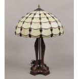 A Tiffany style table lamp with bronze effect base, height 61cm.
