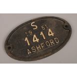 A vintage oval cast iron builders wall plaque reads; S 1951 1414 Ashford.