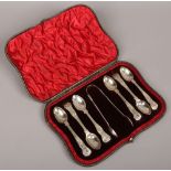 A cased set of silver tea spoons, along with matching sugar tongs, assayed London 1896.