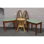 A pair of green leatherette top foot stools, along with a screw top stool and a pair of walnut