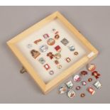 A collection case and loose quantity of mainly enamel pin badges for Russia and the USSR in Lenin.