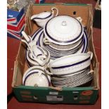 A box of early 20th century Alfred Meakin pottery dinnerwares with blue and gilt decoration