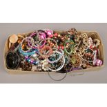 A box of costume jewellery to include beads, bangles, necklaces etc.