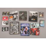 A collection of live music DVDs and cassette tapes to include Oasis, Pink Floyd, Rolling Stones