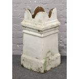 A painted white terracotta chimney pot.