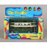 A boxed Corgi The Beatles AEC Routemaster Diecast model bus.