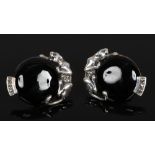 A pair of silver Art Deco style earrings formed with leopards and having marcasite decoration.