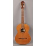 A Manuel Rodriguez C3 classical guitar in gig bag.