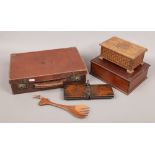 A small suitcase and contents to include carved musical box, tie press and treen etc.