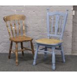 A painted chair and a spindle back kitchen chair.