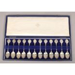 A cased set of 12 silver tea spoons, all with different star sign handles, assayed London 1957 by