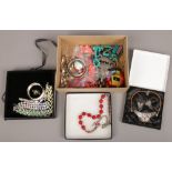 A box of costume jewellery including bangles, beads, coloured glass necklaces etc.