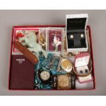 A box of costume jewellery and collectables including marcasite brooches, jade style horse and a