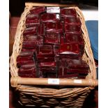 A wicker basket and contents of new and unused wooden jewellery boxes.