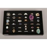 A display case of 36 dress rings to include colour paste stone, cameo examples etc.