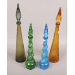 Four 1970s coloured art glass bottles with stoppers.