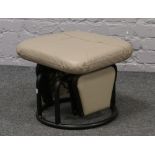 A South American leather covered rocking stool by Relax - R Corporation made in Canada.