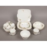 An Art Deco Alfred Meakin bone china part tea service including sandwich plate, cups, saucers,