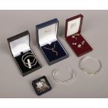 A quantity of silver and white metal costume jewellery to include earrings, bangles, pendant on