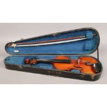 A French violin with two piece back in fitted carry case complete with bow, bow stamped E. Bernard.