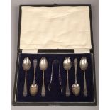 A cased set of six early 20th century silver teaspoons along with a matching pair of sugar tongs,