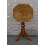 A mahogany tilt top occasional table with tripod base.