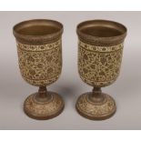 A pair of Indian brass bidriware pedestal vases.