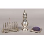 A silver six piece toast rack assayed Birmingham 1936 by Hukin & Heath Ltd. Along with a silver