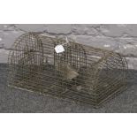 A galvanised wire rat trap.