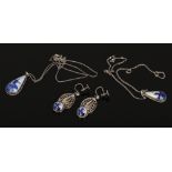 A pair of continental silver earrings set with delft plaques and two matching pendants and chains.