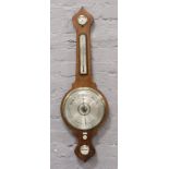 An Edwardian Mercury filled banjo barometer C1870. with silvered dial, thermometer and level