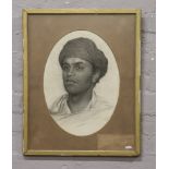 A gilt framed pencil drawing portrait of a middle eastern boy, signed S. Townson 1881.Condition