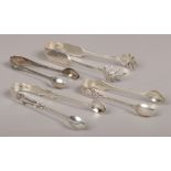 Four pairs of sugar tongs to include claw examples, one pair assayed Sheffield 1931.