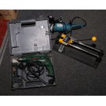 A cased Bosch PSB 600 RE electric hammer drill, Workzone 1150 watt angle grinder and a Plasplugs