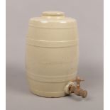 A stoneware spirit keg with wooden tap, height 34cm.