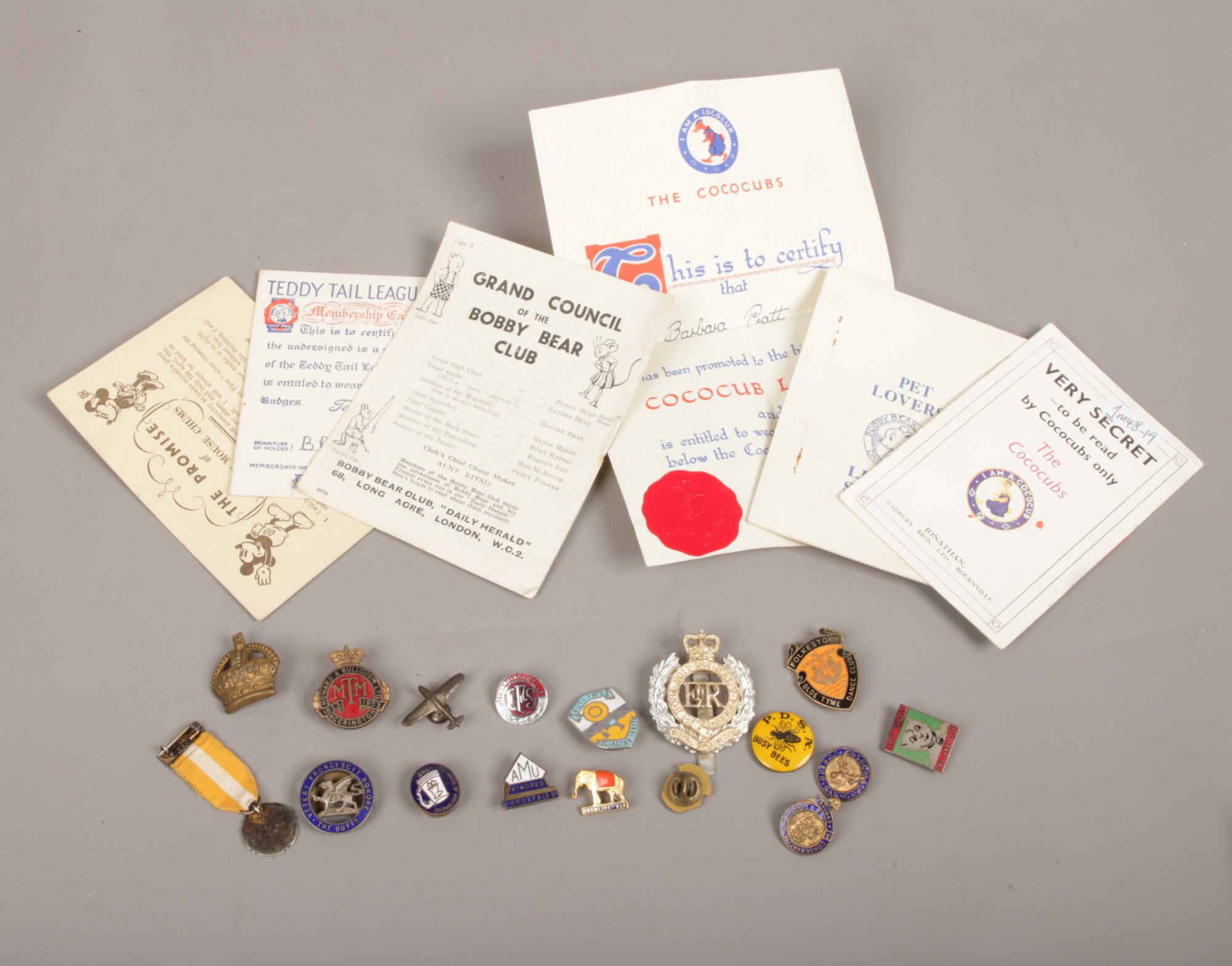 A quantity of mostly vintage enamel pin badges including a Butlins example, along with several