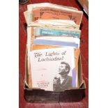 A box of sheet music, mostly classical.