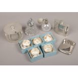 A box of silver plated items including napkin rings, hip flask, perfume atomiser, desk top lighter