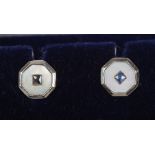 A pair of 9ct gold sapphire and mother of pearl stud earrings.