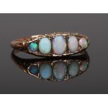 An early 20th century five stone opal ring. Size S.